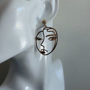 Whimsical Winking Gold Dangle Earrings